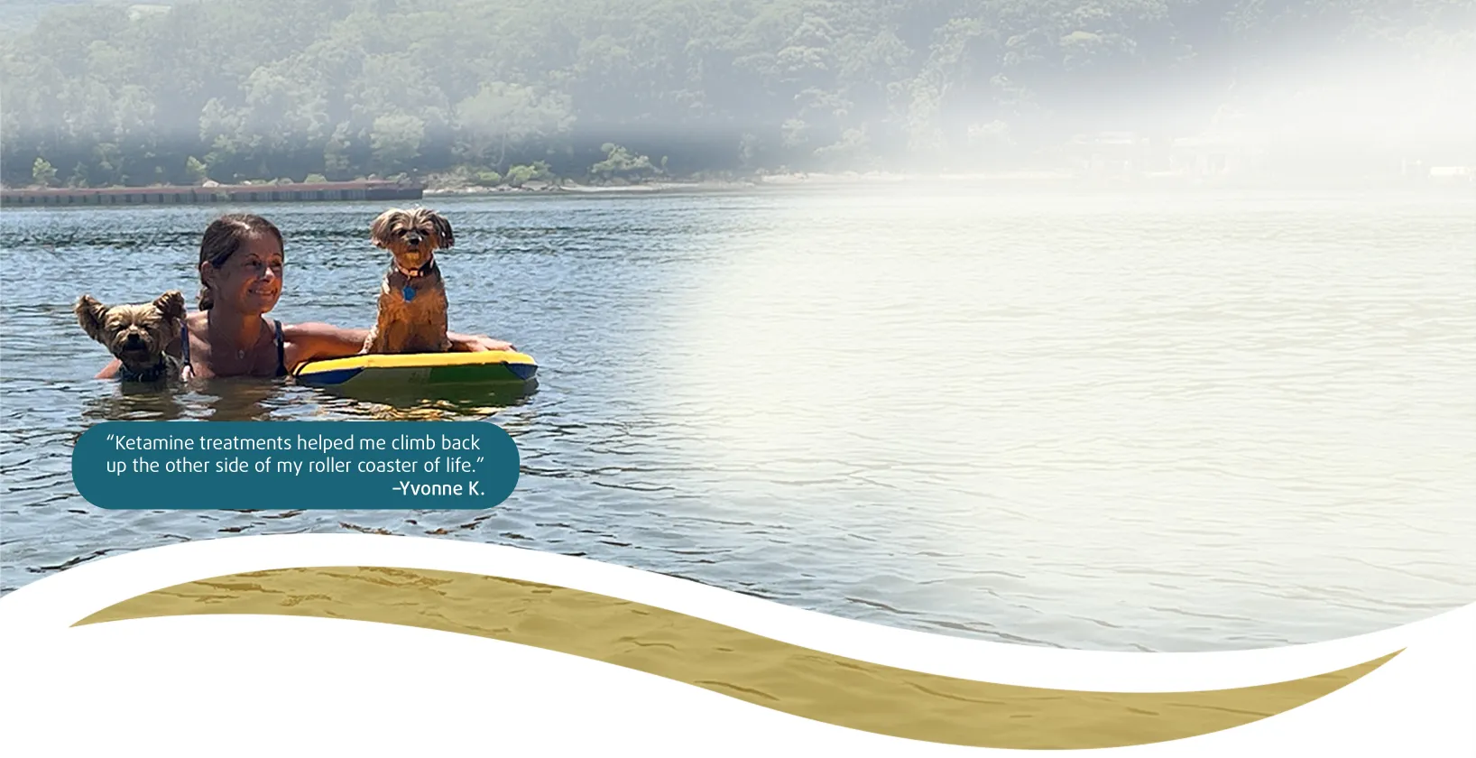 Yvonne swimming with her dogs in lake